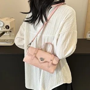 Pink PU leather square crossbody bag with metallic turn-lock and adjustable strap