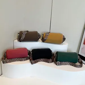 Borse a tracolla cilindriche retrò in cinque colori con spalline larghe leopardate