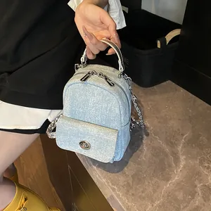 Light blue denim mini handbag with silver chain strap and stylish top handle for women