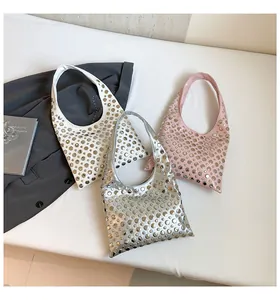 Chic studded hobo bags in white, silver, and pink showing metallic rivets and punk style
