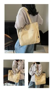 Detail of beige canvas tote bag with front pocket and Midolai logo print