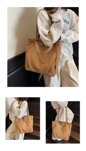 Close-up of durable brown canvas tote bag with front pocket and minimalist branding