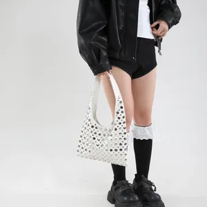 White rivet shoulder bag for women with silver stud decor and trendy crescent hobo style