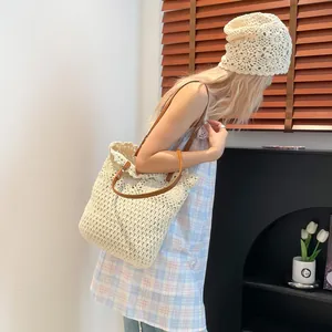 Boho cream crochet tote bag with brown leather straps and matching knit hat for women