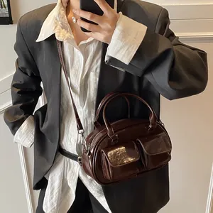 Vintage dark brown faux leather shoulder bag with dual front pockets for daily commute