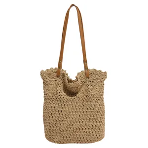 Handcrafted crochet tote bag in khaki with floral patterns and brown leather straps