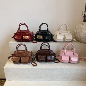 Vintage retro mini Boston bags in multiple colors displayed on elegant stone steps
