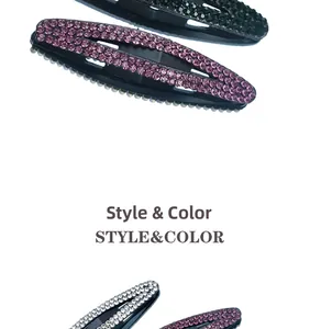 Detailed view of oval rhinestone hair clips in purple, green and white colors
