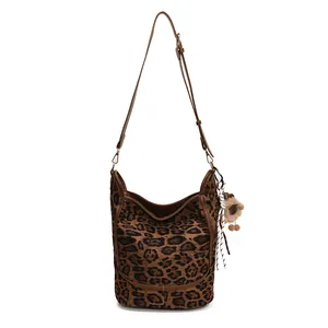 Large leopard print tote bag with adjustable shoulder strap and plush sheep charm decoration