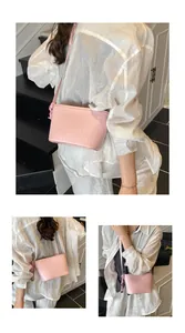 Detail of light pink woven leather texture and knotted shoulder strap on bucket bag