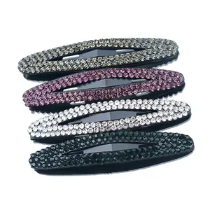 Set of 4 sparkling oval rhinestone hair clips in champagne, purple, white, and dark green