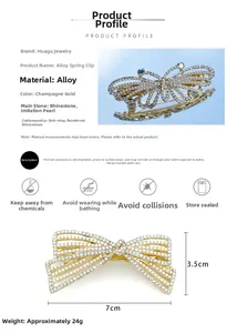 Dettaglio macro del fermaglio per capelli a farfalla oro champagne con strass e misure