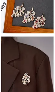 Macro view of crystal flower leaf brooches in rose gold and diverse gem colors