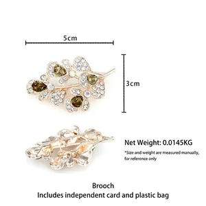 Elegant gold crystal flower brooch with olive green pear-cut stones for suit jackets