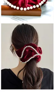Close-up and lifestyle view of dark red velvet hair scrunchie with white pearl trim