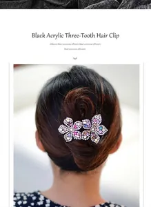 Macro shot of a black acrylic 3-prong hair claw clip with colorful sparkling rhinestones
