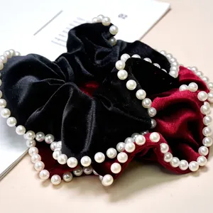 Elegant velvet scrunchies in black and burgundy with white pearl beaded edges