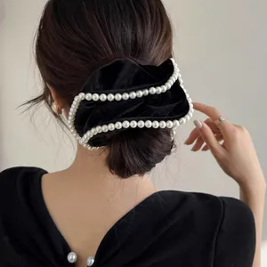 Elegant large black velvet hair scrunchie with white pearl trim decoration for women