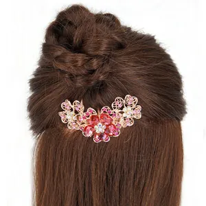 Vintage bridal flower hair comb with red rhinestones and rose gold metal floral design