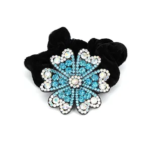 Elastico per capelli con fiore di strass blu e base in velluto nero per acconciature