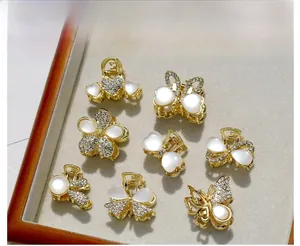 Mini Haarklammern aus Gold mit Katzenaugensteinen und Strass in Blumen und Herzform