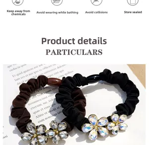 Detail of high-elasticity hair ties with crystal flower accents and pleated fabric texture