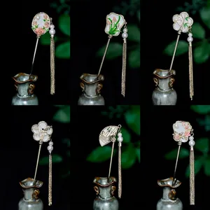 Elegant Chinese hairpins with floral enamel motifs and long golden metal tassels