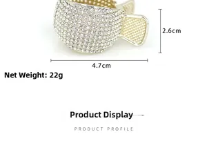 Close-up of golden metal claw clip with rhinestones, sized 4.7cm by 2.6cm