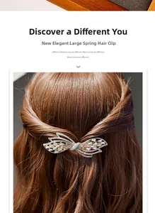Detailed close-up of a large butterfly spring clip with sparkling rhinestones on hair