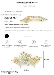 Detailed view of luxury gold butterfly hair clip with sparkling rhinestones and zircons