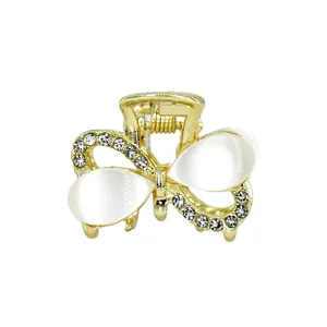 Goldene Schmetterlings-Haarklammer mit Katzenaugensteinen und glänzenden Strass