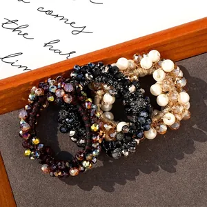 Set di 4 eleganti elastici per capelli con perle e corde intrecciate per donna