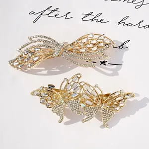 Elegant gold butterfly hair clips with sparkling crystals and rhinestones for women