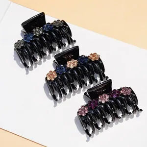 Three-piece set of black acrylic hair claws with colorful rhinestone floral ornaments