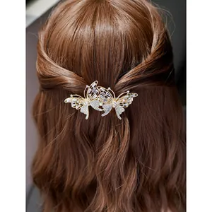 Elegant gold butterfly hair clip with sparkling rhinestones for women's half-up hairstyle
