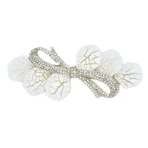 Elegant silver alloy spring clip with white leaf petals, rhinestones and faux pearls