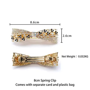 Golden alloy rhinestone bow hair clip with flower accents and metal spring fastener