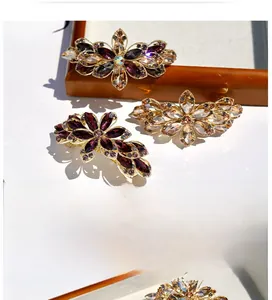 Macro view of flower hair clip detailing intricate sparkling crystals and metal craftsmanship