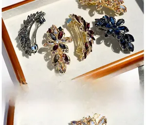 Macro view of crystal flower hair clips with sparkling rhinestones in assorted colors