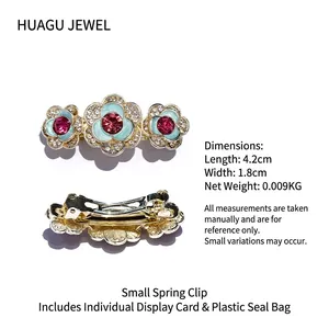Pink rhinestone flower spring hair clip in gold metal finish measuring 4.2cm length