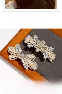 Detail of luxury pearl and crystal spring hair clips set in elegant gold alloy finish