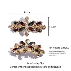 Elegant floral crystal spring hair clip with red rhinestones measuring 8.1cm x 4.5cm