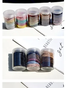 Detail of high-elasticity hair ties in a transparent storage jar with various colors