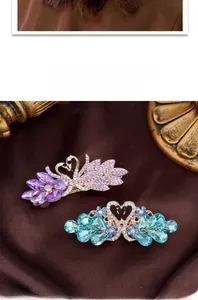 Detail of luxury swan hair clips with purple and blue crystals on gold base