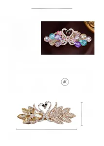 Detail view of crystal swan hair clip with rose gold plating and rhinestone inlay