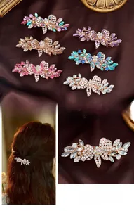 Macro shot of elegant rose gold floral hair clip set with colorful sparkling crystals