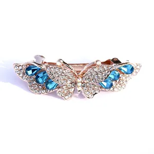 Eleganter Schmetterlings-Haarclip mit blauen Kristallen und Strass auf Roségold