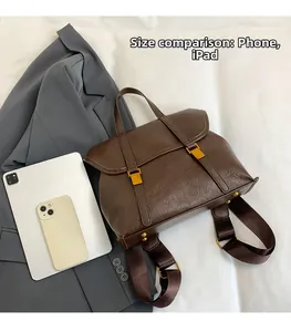 Detailed view of the large capacity retro backpack showing scale relative to a tablet