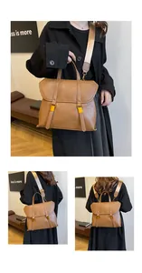 Detail of vintage caramel briefcase with adjustable strap shown in three-way carry style