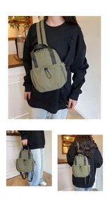 Detail of olive green nylon bag showing drawstring pocket and woven fashion label